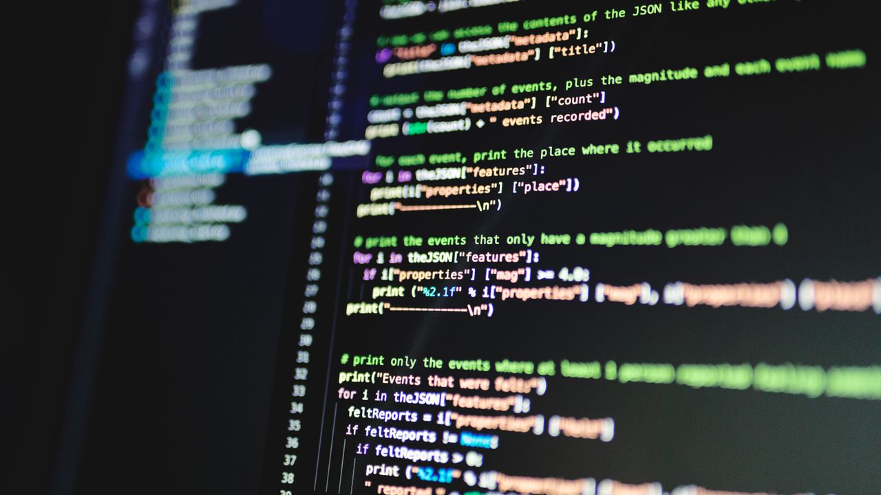 Close-up of colorful programming code displayed on a computer monitor