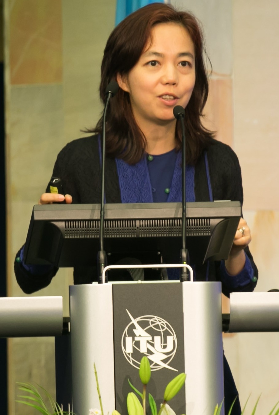 Fei-Fei Li, founder of World Labs, speaking on stage at the AI for Good summit in 2017