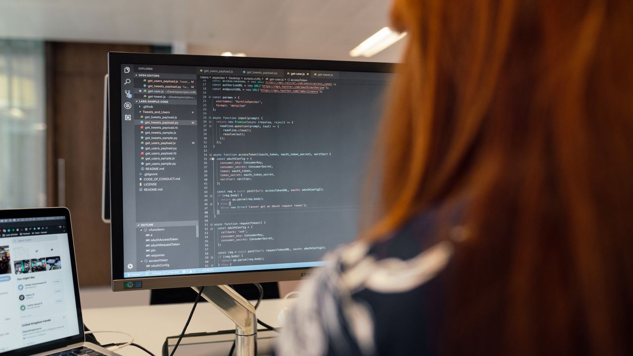 A software engineer working on code at a computer