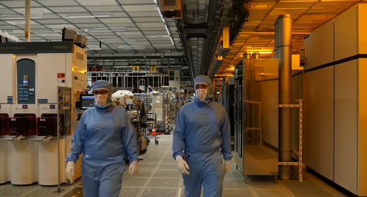 Workers inside a semiconductor fabrication cleanroom